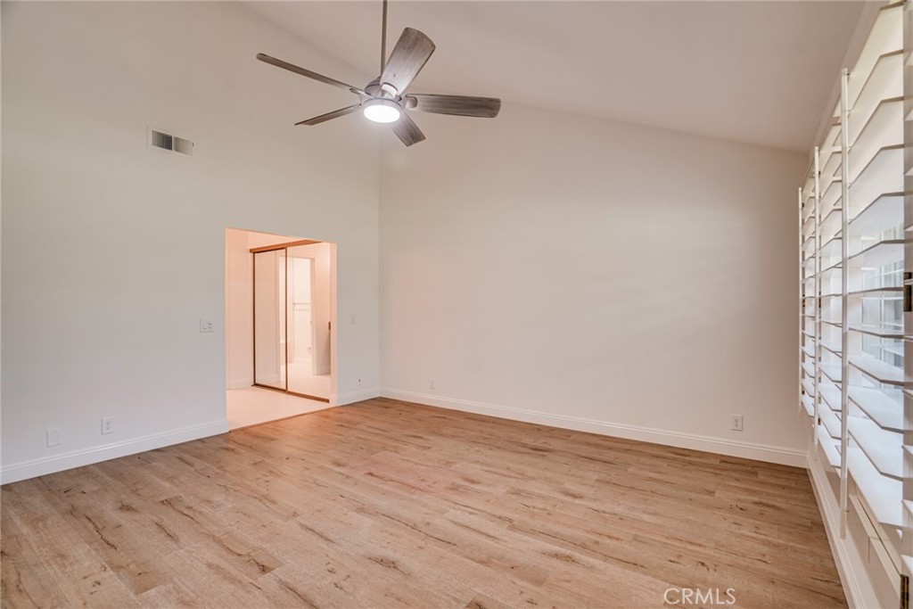 49 East Yale Loop, Unit 26 Irvine, CA 92604 - Photo 35 of 63 wooden floor in an empty room with a window