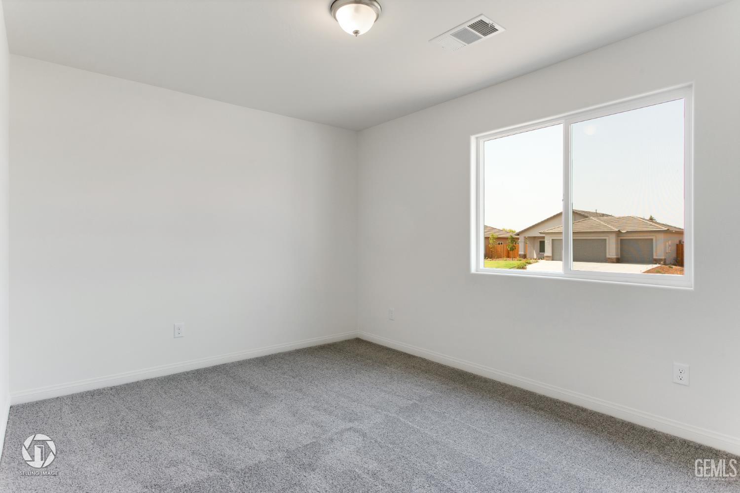 Undisclosed Address Shafter, CA 93263 - Photo 16 of 27 an empty room with a window