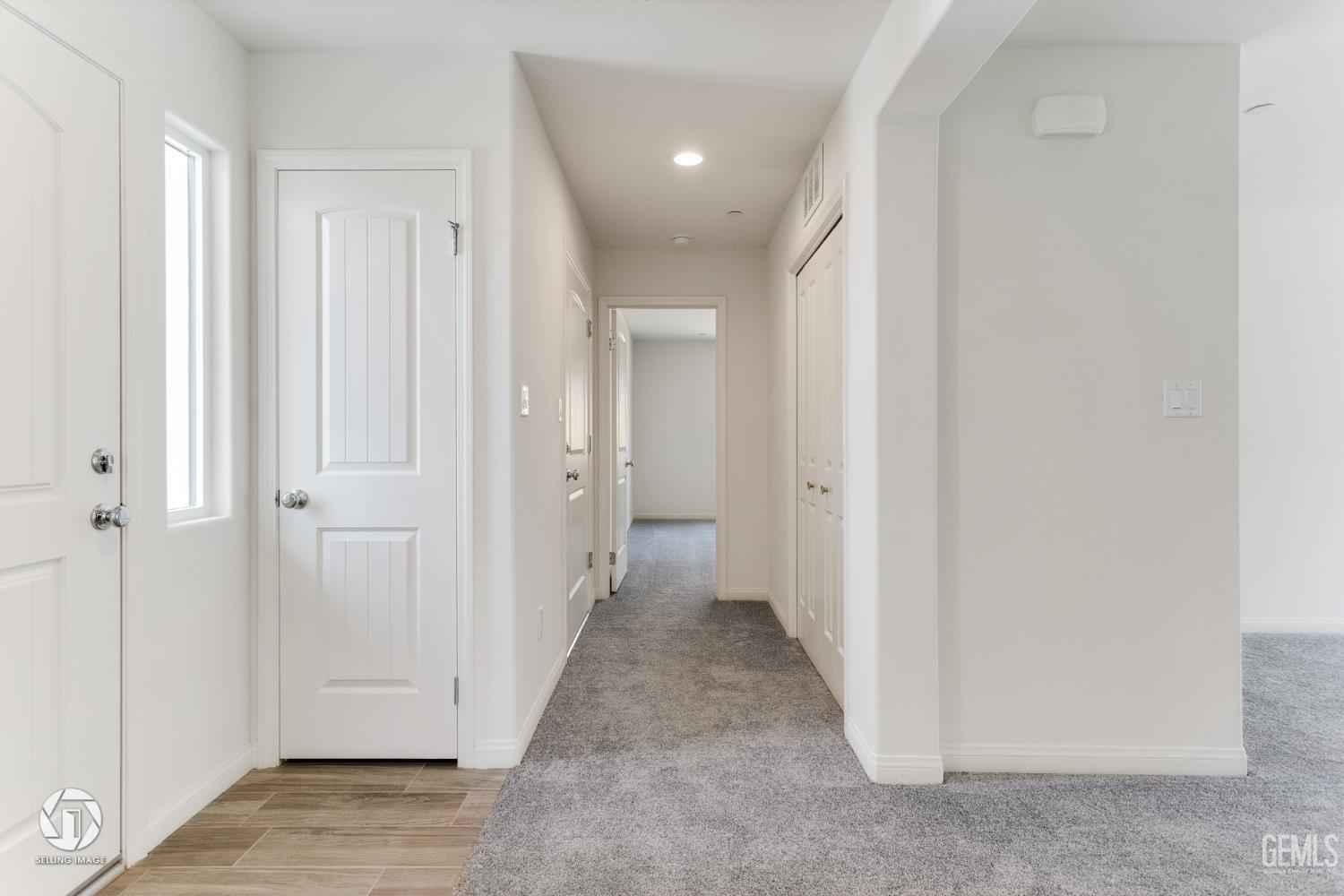 Undisclosed Address Shafter, CA 93263 - Photo 26 of 27 a view of a hallway with wooden floor