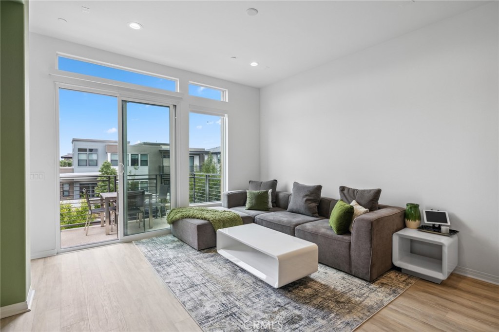 160 Keeper Irvine, CA 92618 - Photo 11 of 29 a living room with furniture and a floor to ceiling window