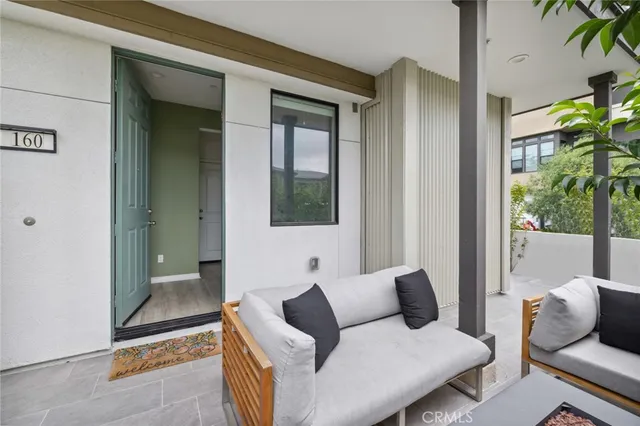 a view of an outdoor kitchen with a porch