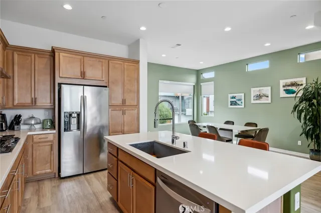 a dining room with furniture and wooden floor