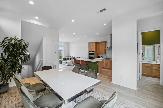 a living room with furniture and kitchen view