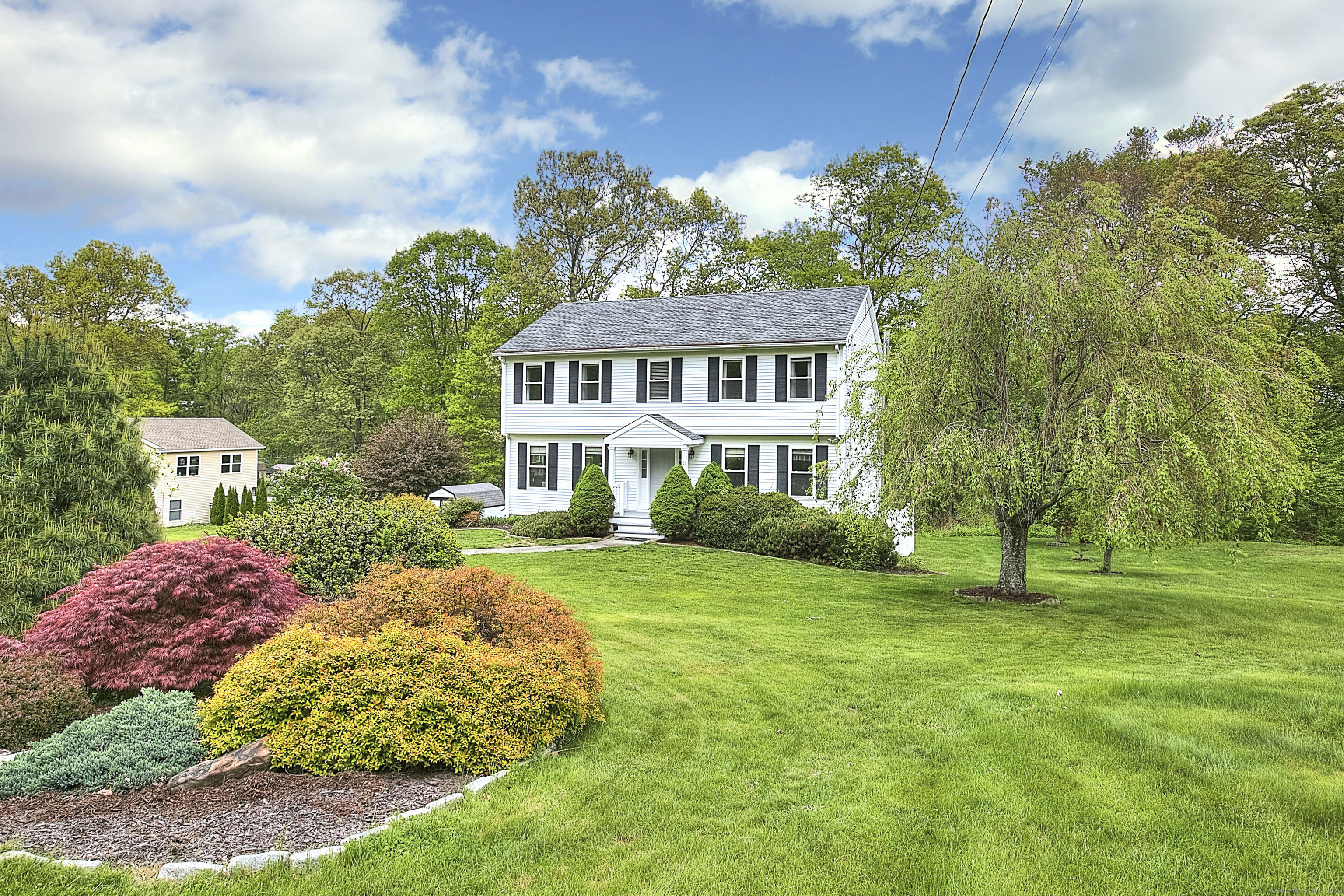 23 Davis Road Seymour, CT 06483 - Photo 1 of 1 a front view of a house with garden