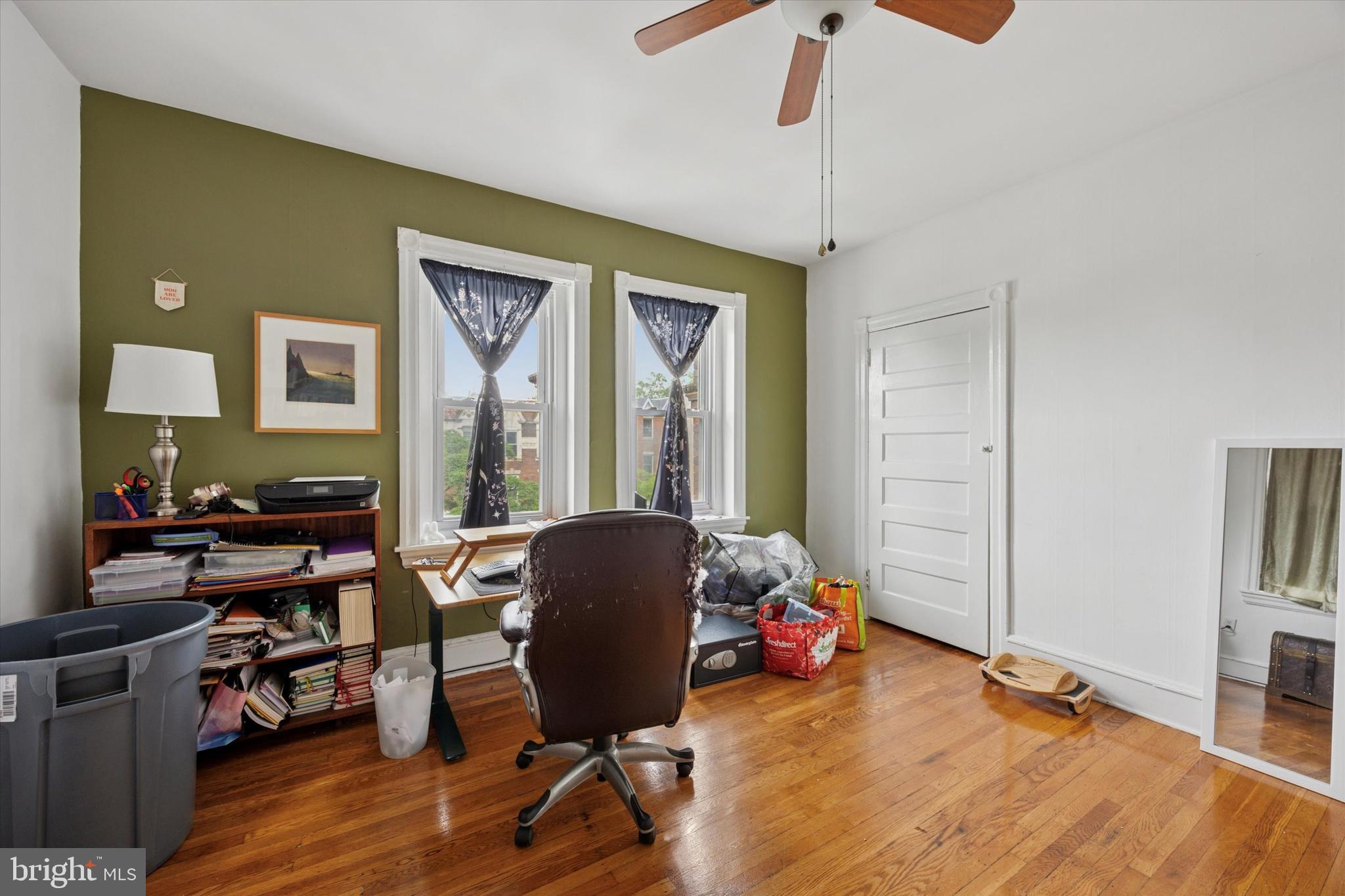 238 South 45th Street Philadelphia, PA 19104 - Photo 3 of 11 a workspace with furniture window and wooden floor