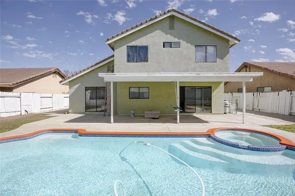 a front view of a house with swimming pool