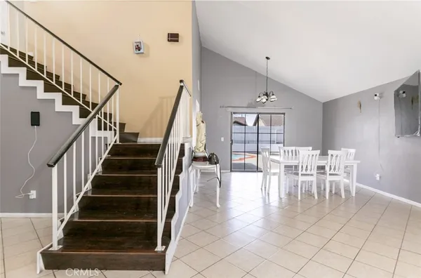 a view of entryway and hall with dining room
