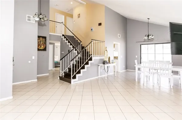 a view of entryway and hall with a living room