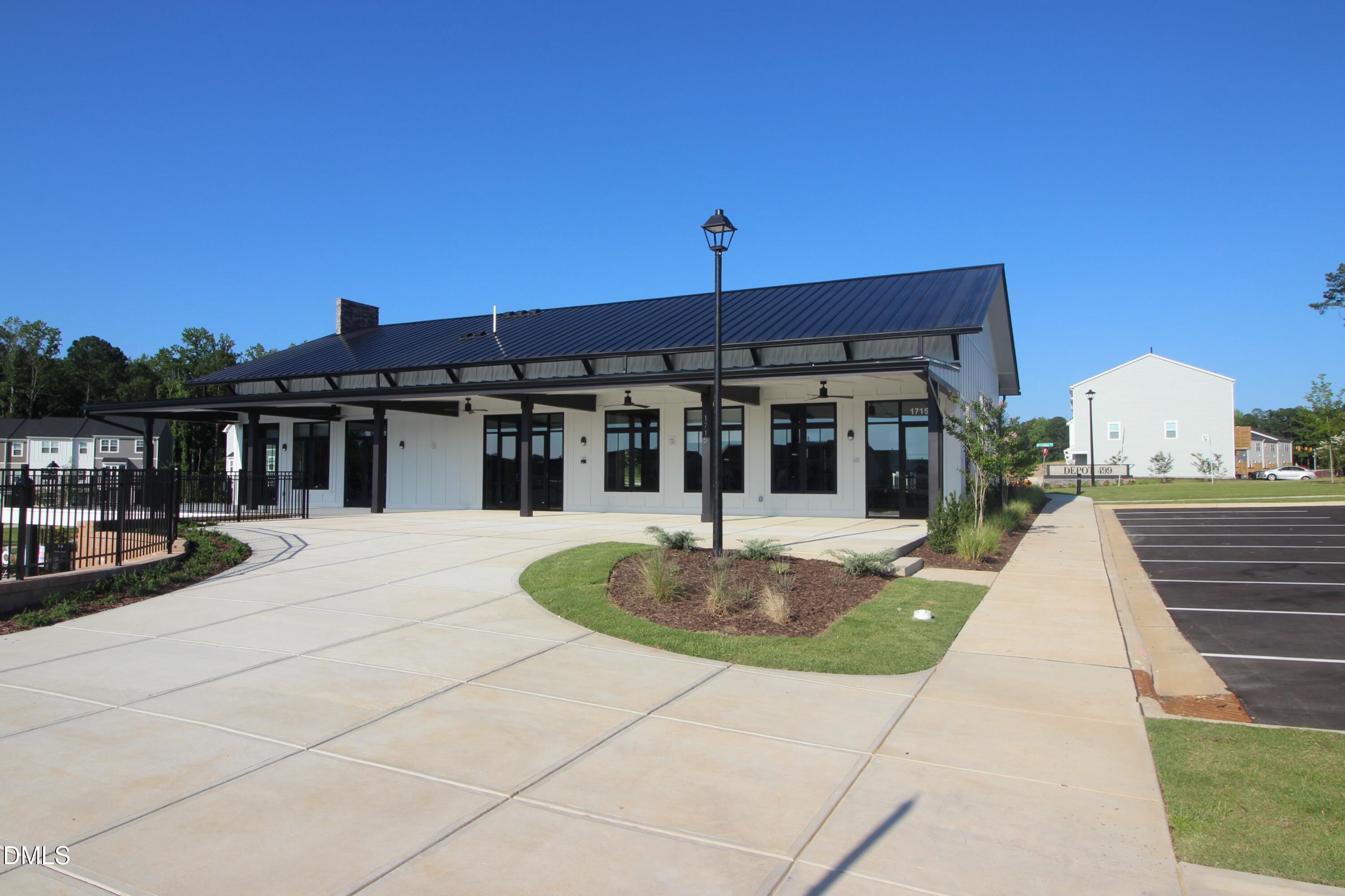 1705 Barrett Run Trail Apex, NC 27502 - Photo 21 of 24 a front view of a house with a garden