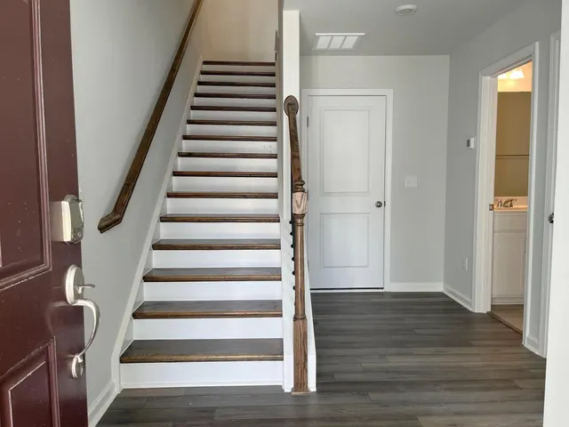 a view of an entryway with wooden floor