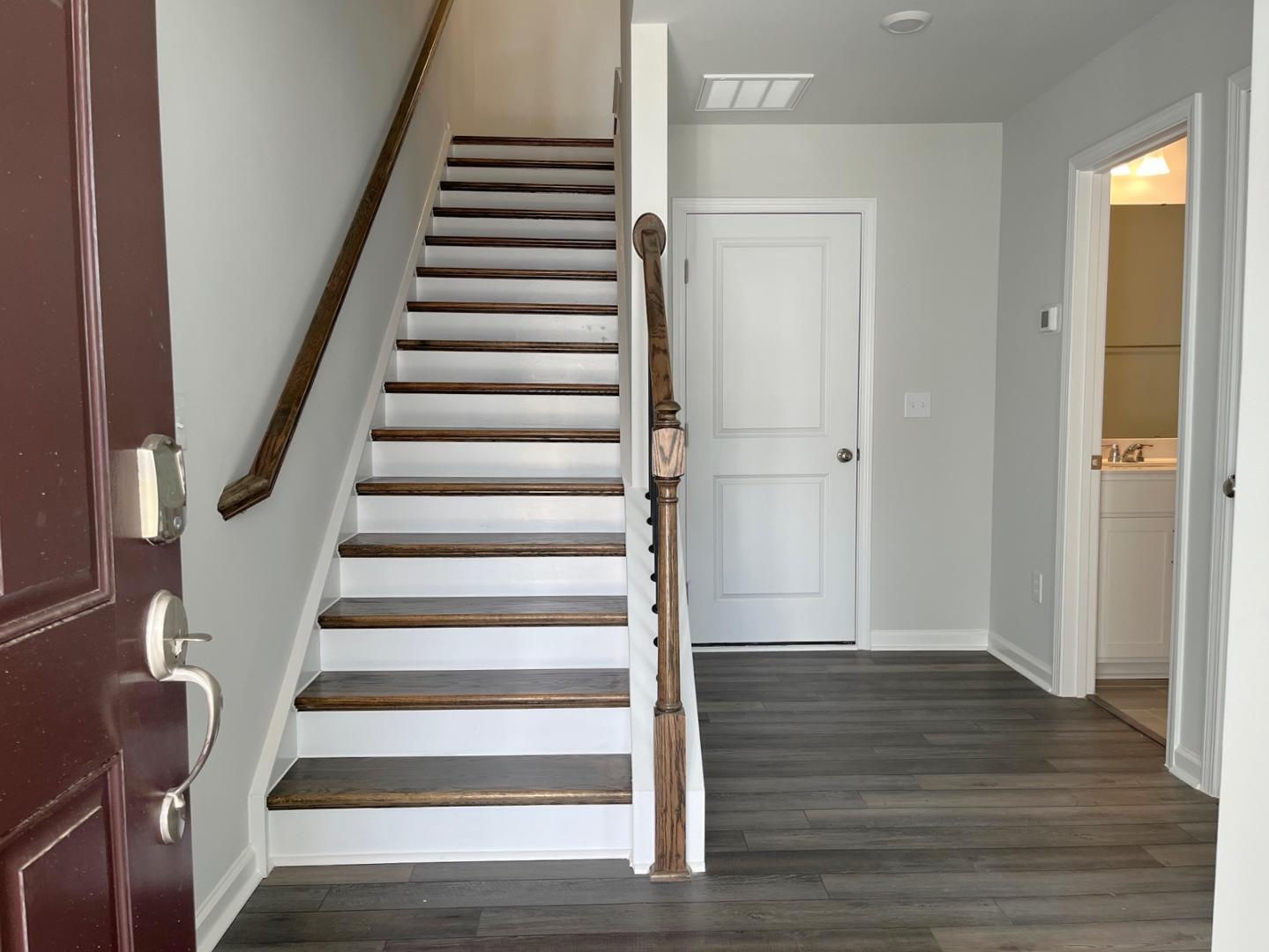 1705 Barrett Run Trail Apex, NC 27502 - Photo 3 of 24 a view of an entryway with wooden floor