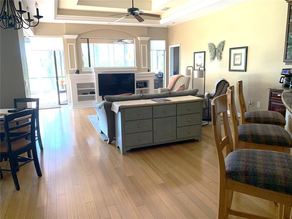 6828 Honeysuckle Trail Lakewood Ranch, FL 34202 - Photo 16 of 36 a living room with furniture and a flat screen tv