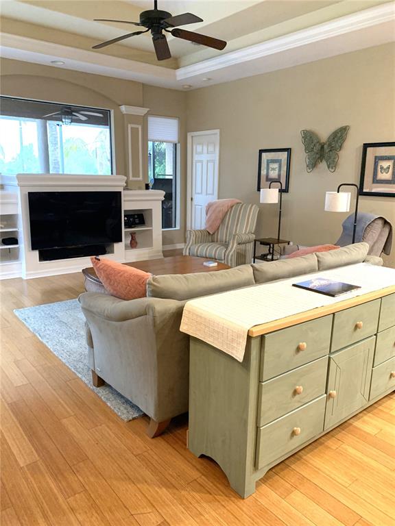 6828 Honeysuckle Trail Lakewood Ranch, FL 34202 - Photo 17 of 36 a living room with granite countertop furniture and a fireplace