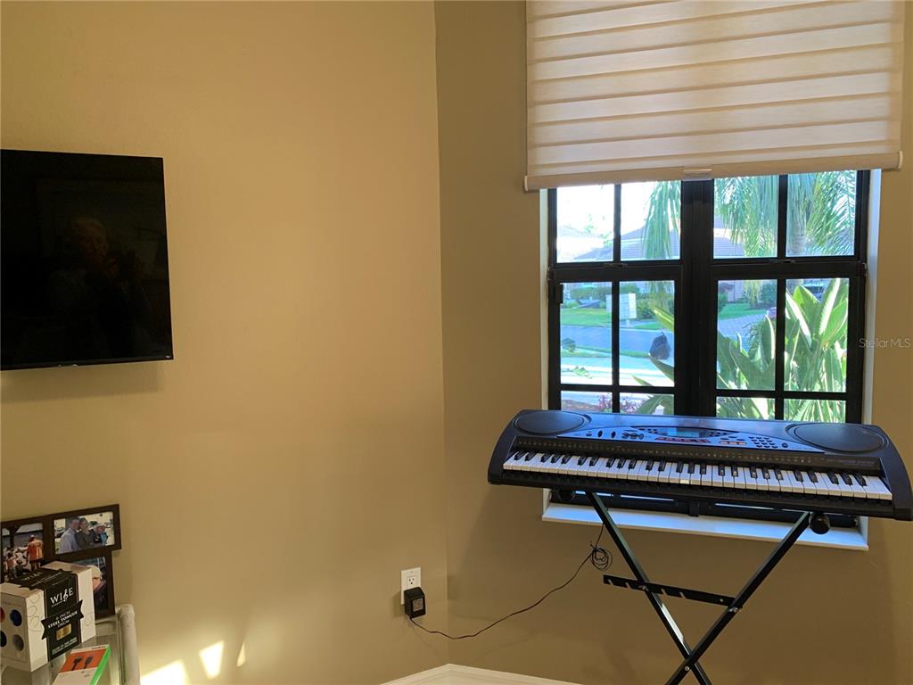 6828 Honeysuckle Trail Lakewood Ranch, FL 34202 - Photo 19 of 36 a room with pool table and windows