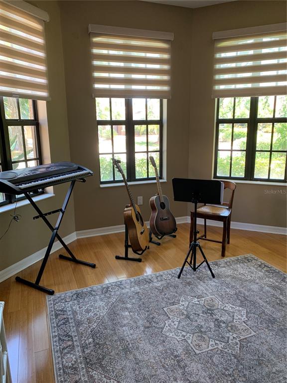 6828 Honeysuckle Trail Lakewood Ranch, FL 34202 - Photo 20 of 36 a living room with furniture and a window