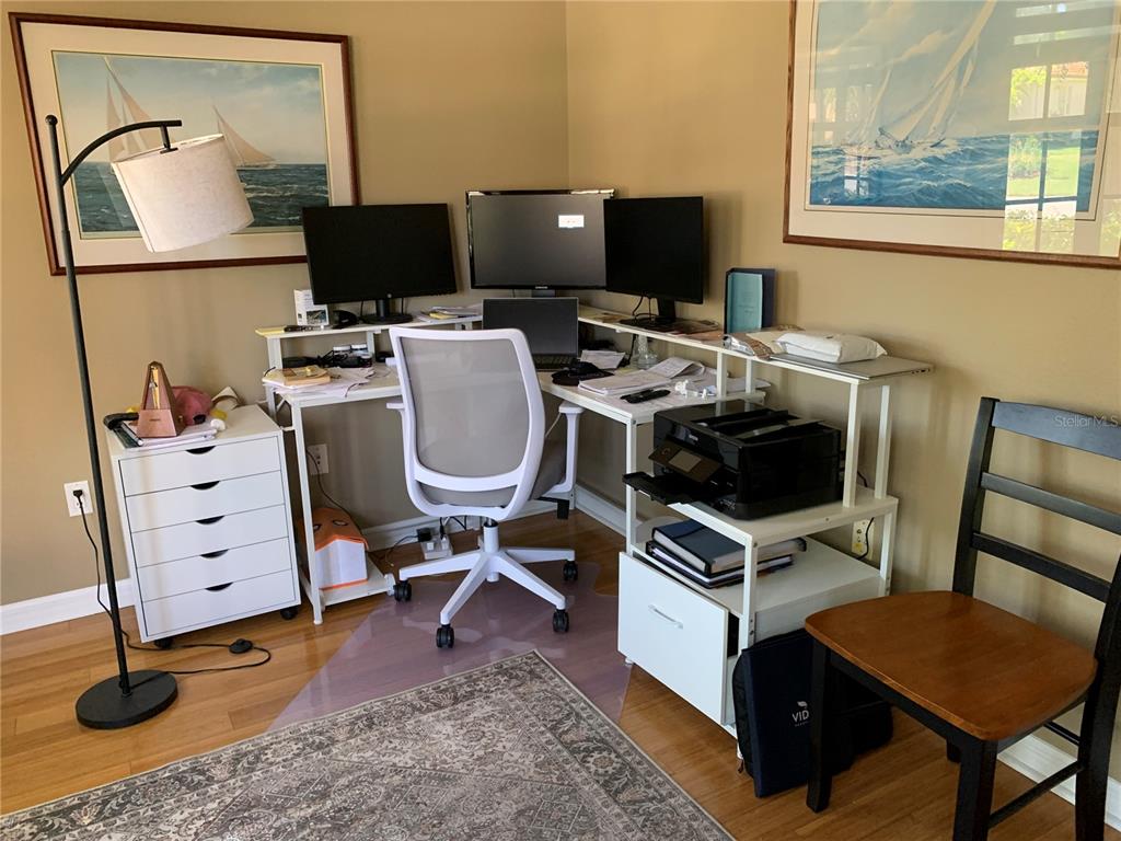 6828 Honeysuckle Trail Lakewood Ranch, FL 34202 - Photo 22 of 36 a view of a workspace with furniture and a window