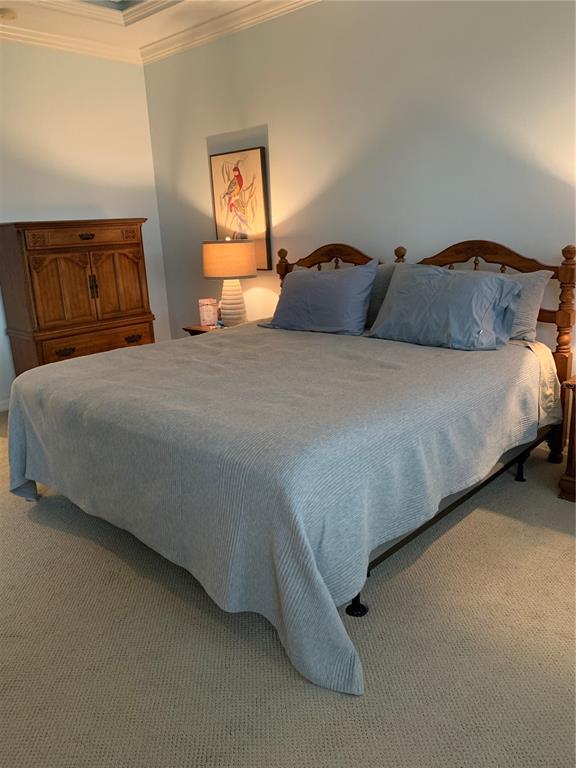 6828 Honeysuckle Trail Lakewood Ranch, FL 34202 - Photo 25 of 36 a bedroom with a bed and lamp