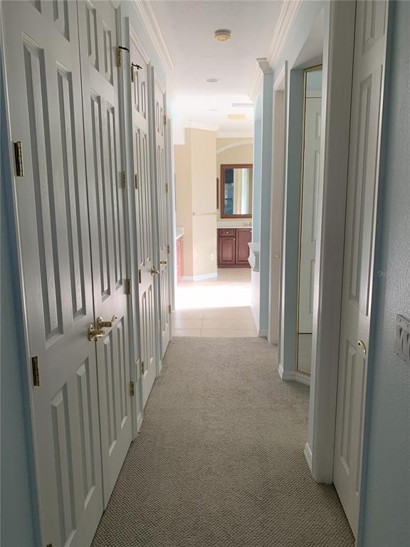 6828 Honeysuckle Trail Lakewood Ranch, FL 34202 - Photo 28 of 36 a view of a hallway with wooden floor and staircase