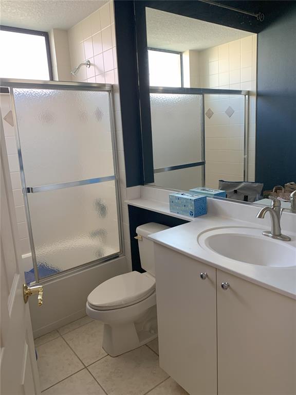 6828 Honeysuckle Trail Lakewood Ranch, FL 34202 - Photo 30 of 36 a bathroom with a sink a mirror toilet and window