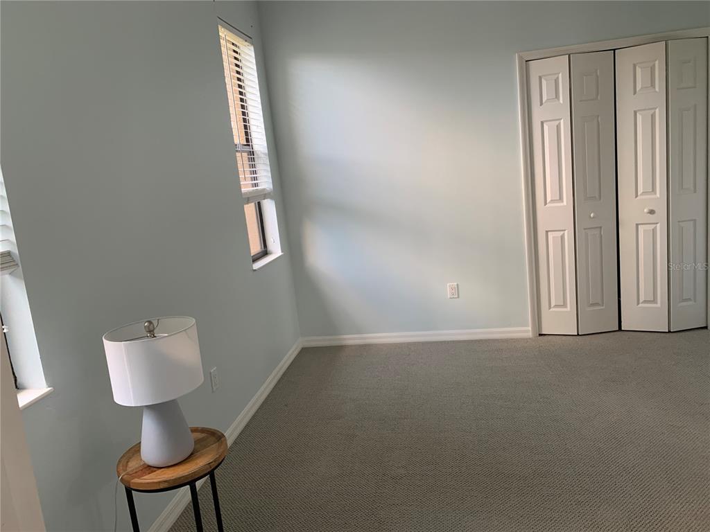 6828 Honeysuckle Trail Lakewood Ranch, FL 34202 - Photo 32 of 36 a view of an empty room and a gallery
