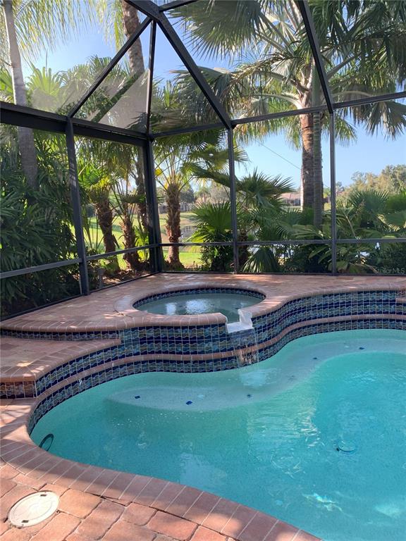 6828 Honeysuckle Trail Lakewood Ranch, FL 34202 - Photo 4 of 36 a view of a swimming pool with a patio