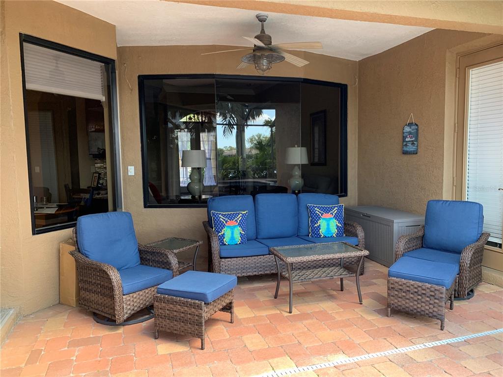 6828 Honeysuckle Trail Lakewood Ranch, FL 34202 - Photo 6 of 36 a living room with furniture and a potted plant