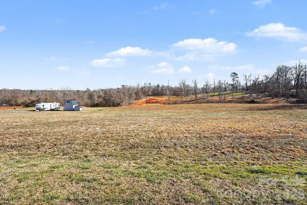 a view of a yard with trees
