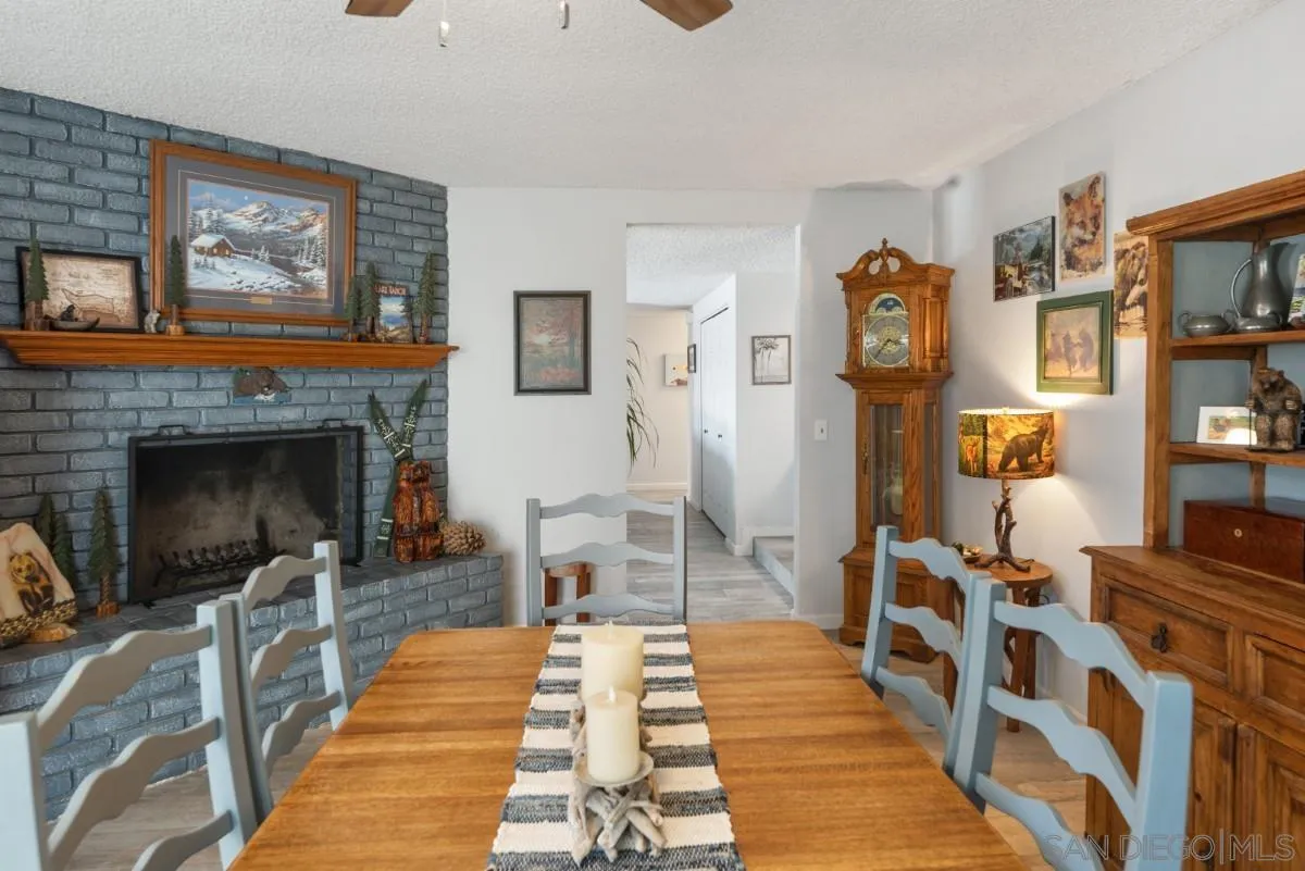 10952 Avenida Roberta Spring Valley, CA 91978 - Photo 14 of 35 a living room with furniture and a fireplace