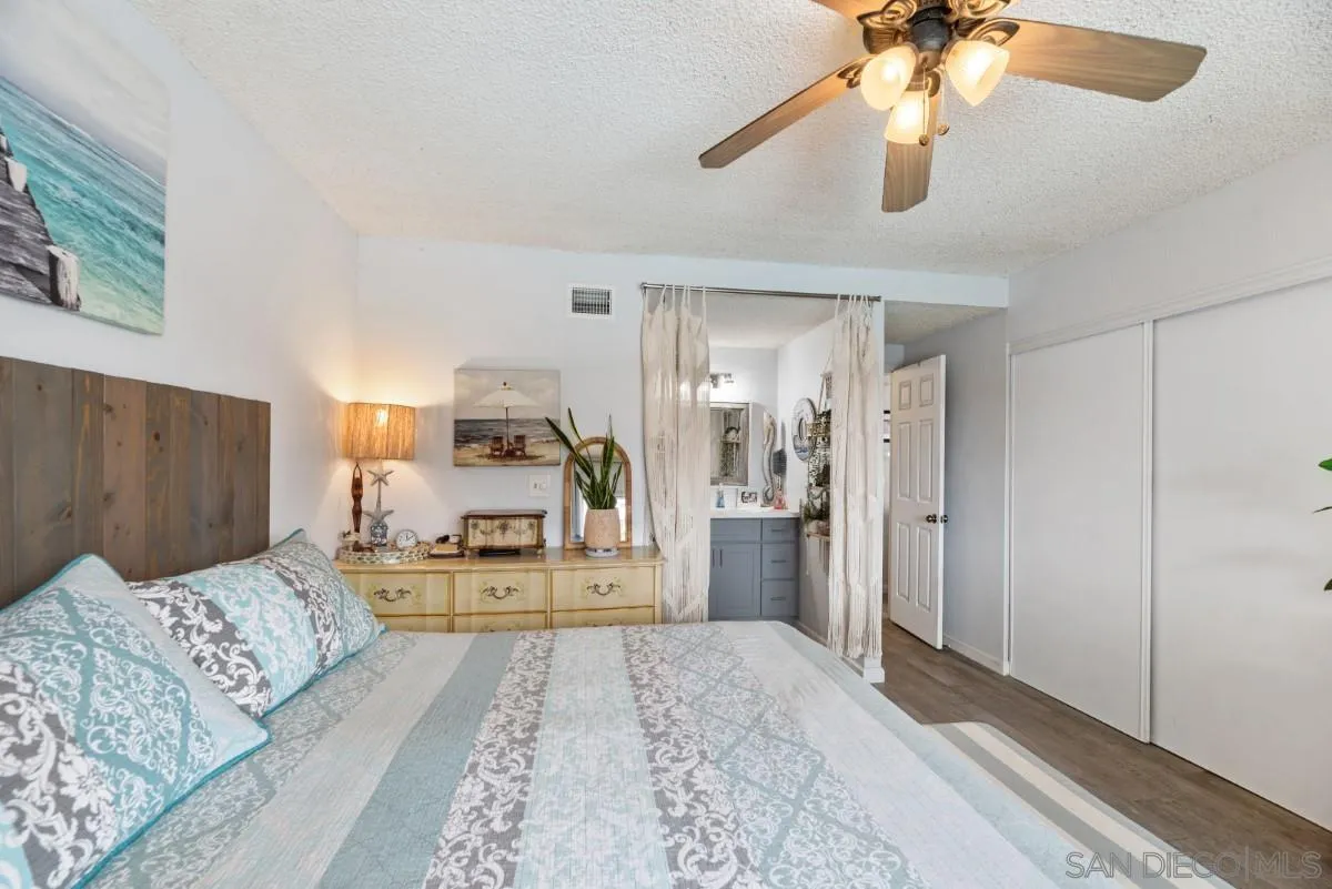 10952 Avenida Roberta Spring Valley, CA 91978 - Photo 16 of 35 a bed room with a bed and a view of kitchen