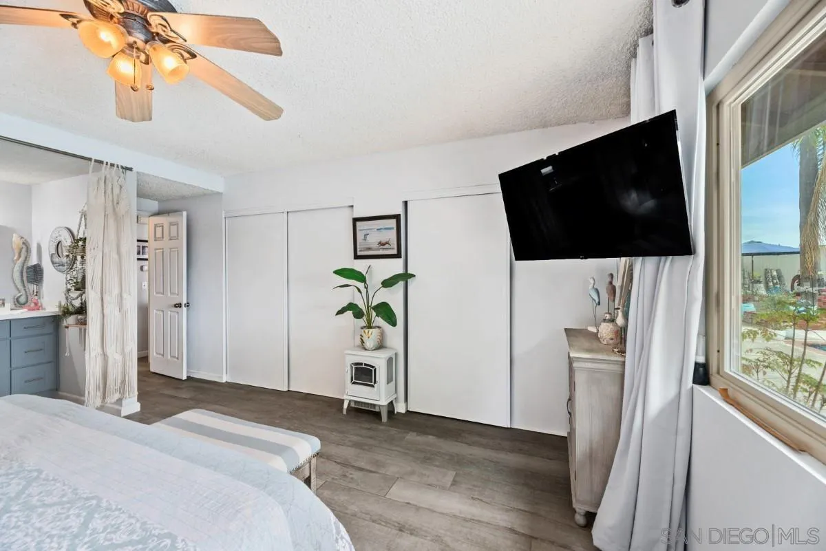 10952 Avenida Roberta Spring Valley, CA 91978 - Photo 17 of 35 a bedroom with a bed and a flat screen tv