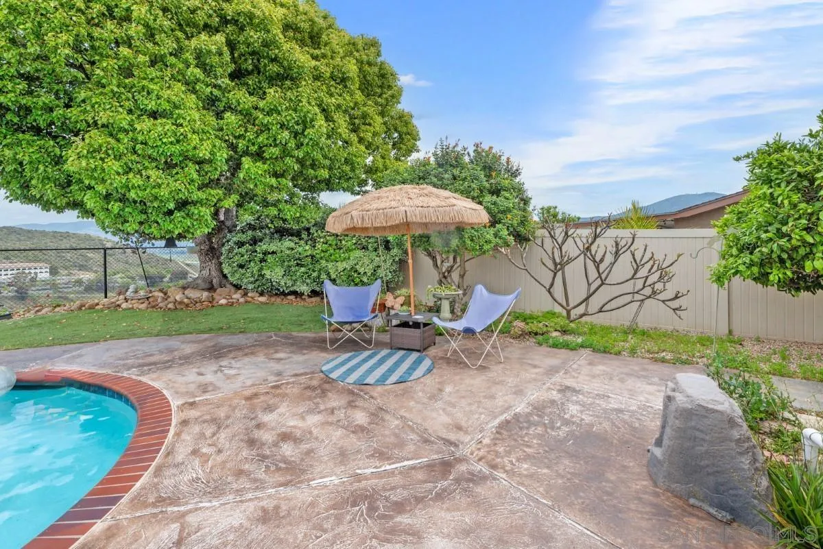10952 Avenida Roberta Spring Valley, CA 91978 - Photo 26 of 35 a view of a backyard with plants and a bench