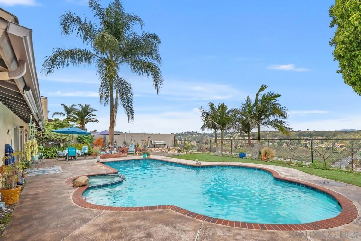 10952 Avenida Roberta Spring Valley, CA 91978 - Photo 27 of 35 a view of a swimming pool with a yard