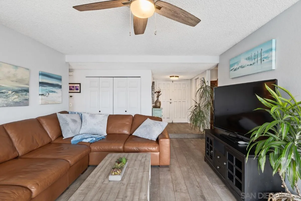 10952 Avenida Roberta Spring Valley, CA 91978 - Photo 8 of 35 a living room with furniture and a flat screen tv
