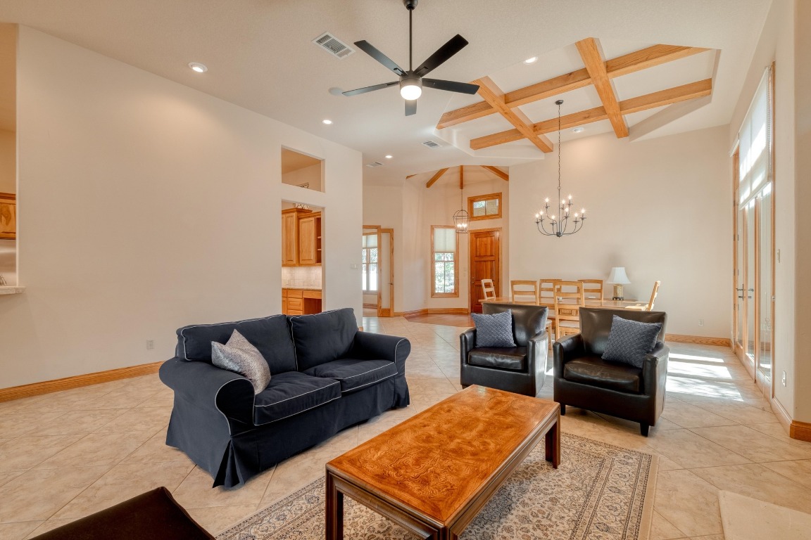 205 Flint Ridge Trail Georgetown, TX 78628 - Photo 11 of 40 a living room with furniture a ceiling fan and a rug