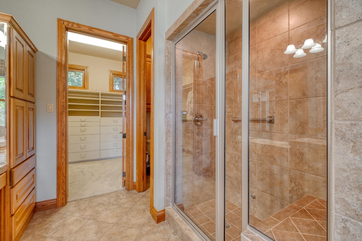 205 Flint Ridge Trail Georgetown, TX 78628 - Photo 23 of 40 a bathroom with a shower