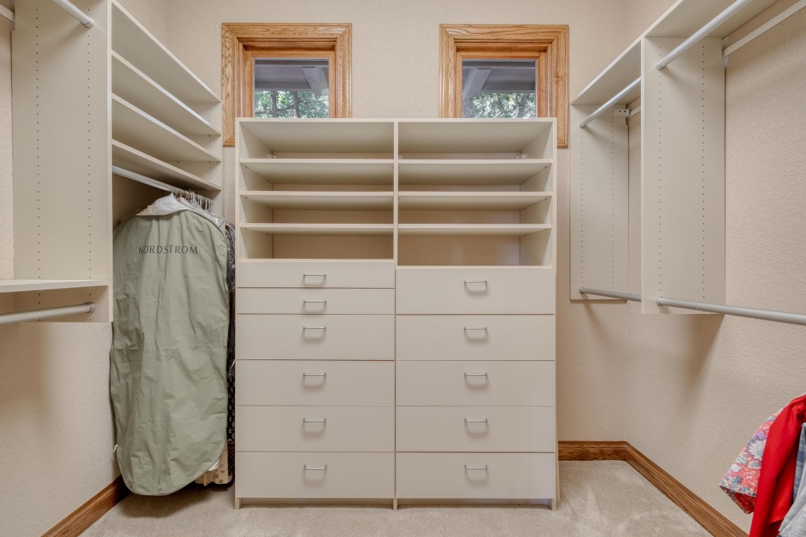 205 Flint Ridge Trail Georgetown, TX 78628 - Photo 24 of 40 a view of walk in closet with empty racks