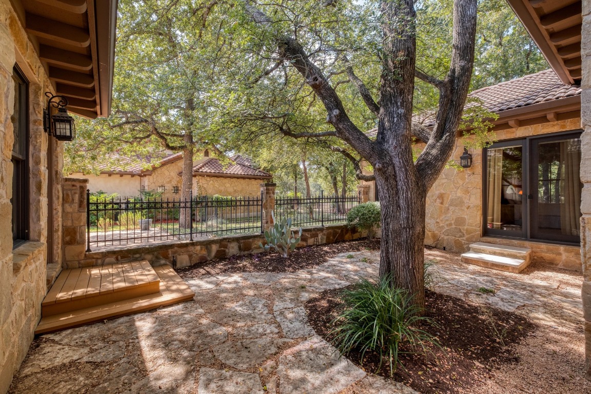 205 Flint Ridge Trail Georgetown, TX 78628 - Photo 35 of 40 a backyard of a house with lots of green space