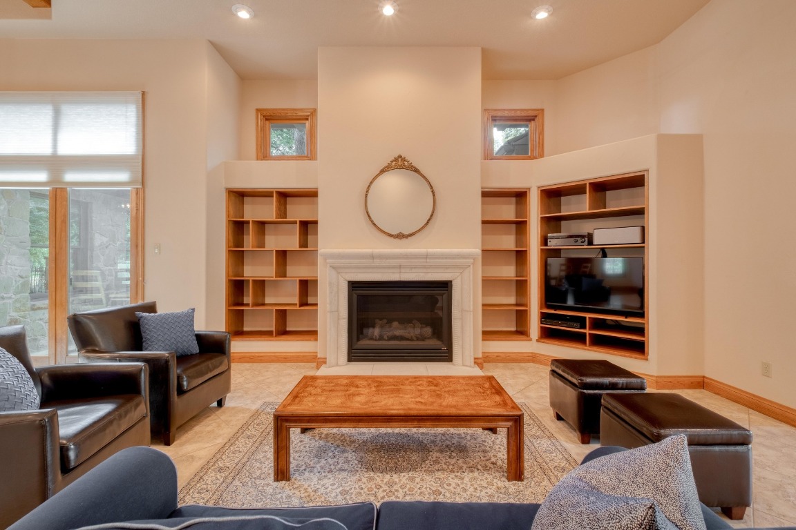 205 Flint Ridge Trail Georgetown, TX 78628 - Photo 8 of 40 a living room with furniture and a fireplace