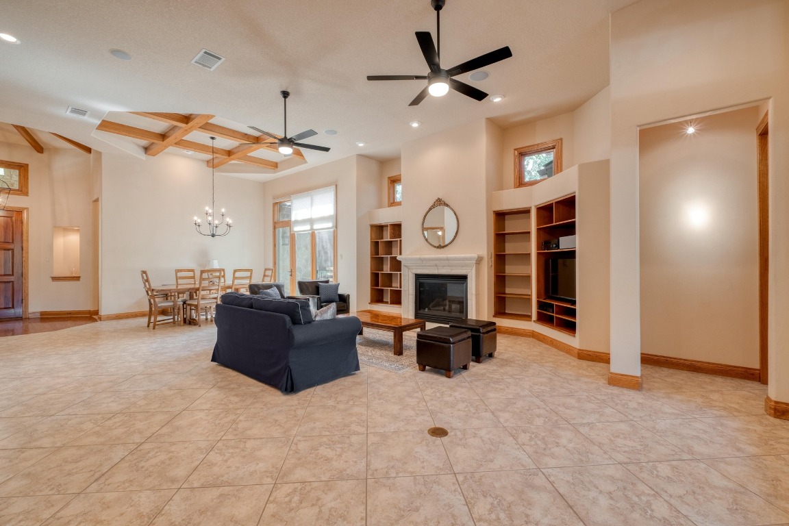 205 Flint Ridge Trail Georgetown, TX 78628 - Photo 9 of 40 a living room with furniture a ceiling fan and a window