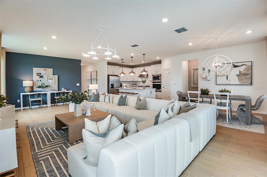 3709 Obsidian Drive Spring Hill, FL 34609 - Photo 7 of 19 a living room with furniture and a chandelier
