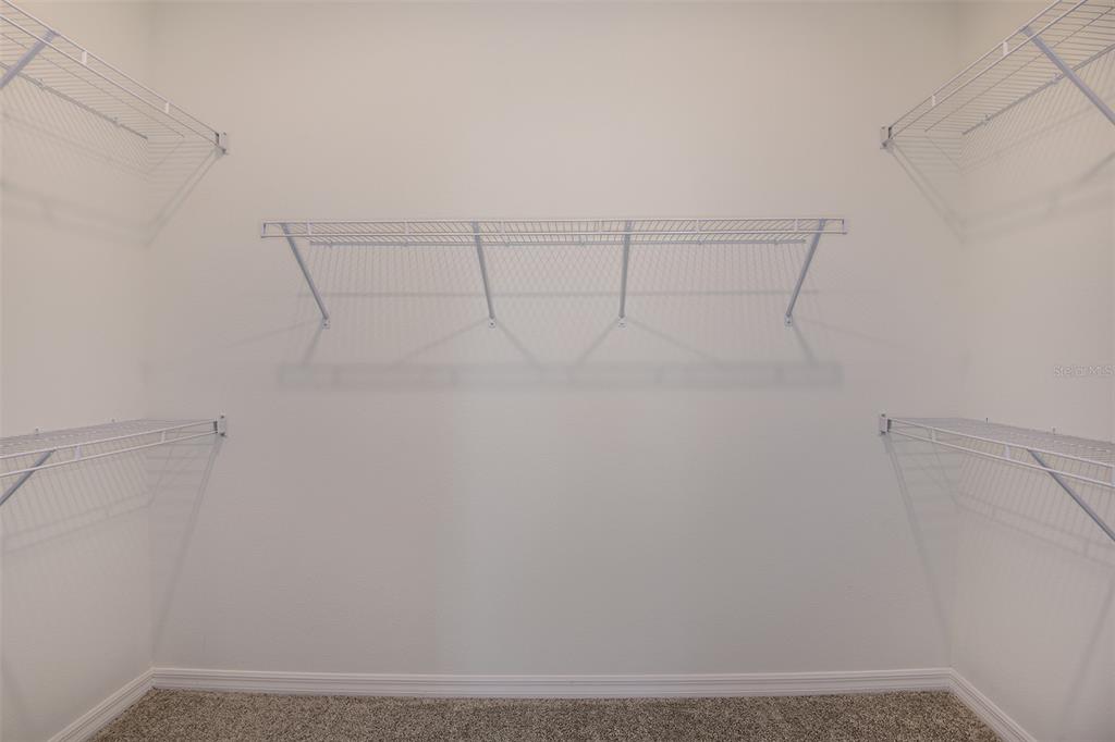 3709 Obsidian Drive Spring Hill, FL 34609 - Photo 9 of 19 a view of a room with racks on the wall