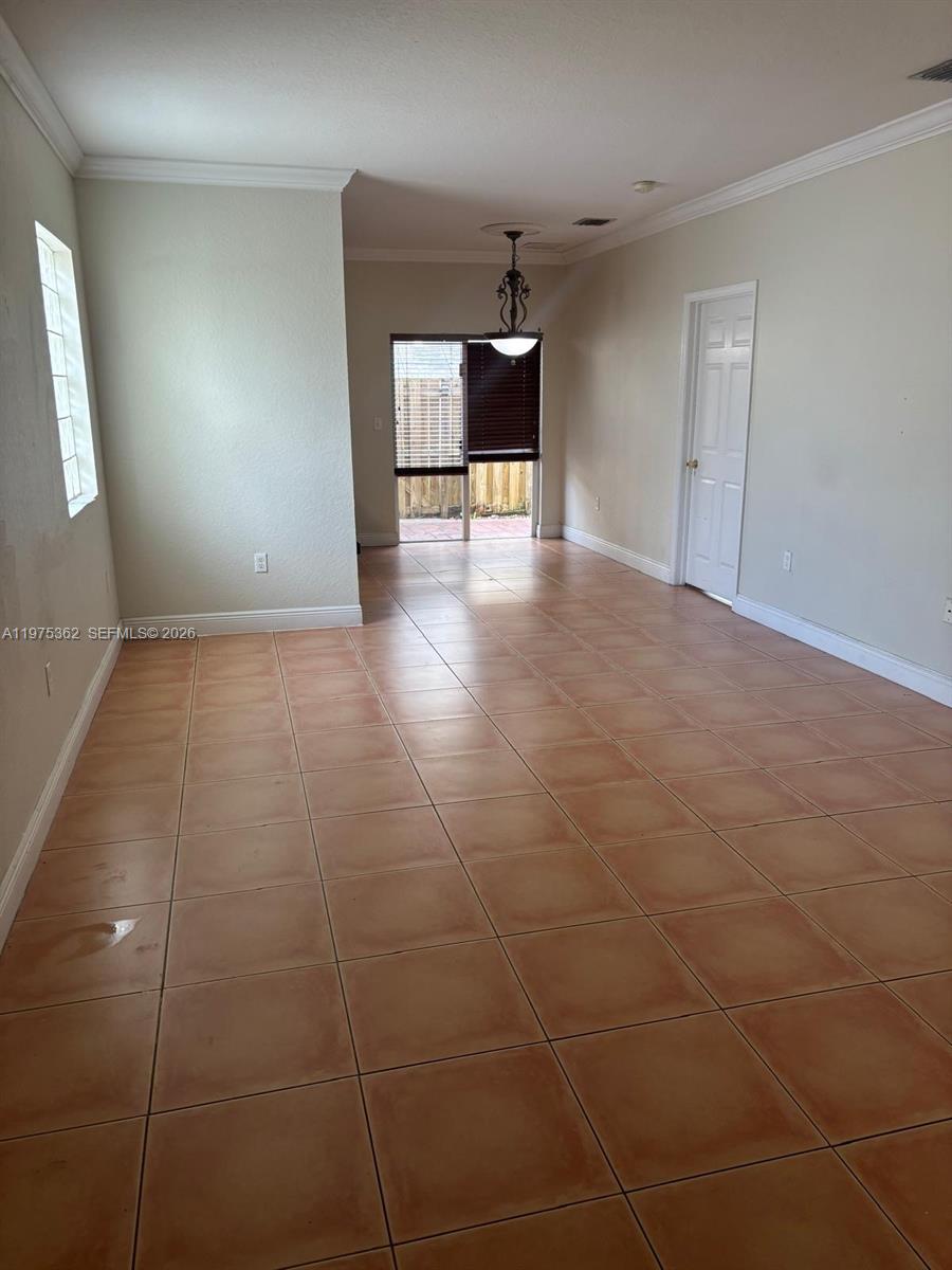 371 Northeast 26th Terrace, Unit 101 Homestead, FL 33033 - Photo 4 of 10 a view of a livingroom with a staircase