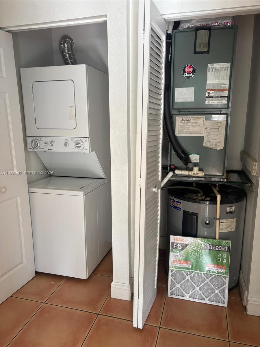 371 Northeast 26th Terrace, Unit 101 Homestead, FL 33033 - Photo 8 of 10 a utility room with dryer and washer