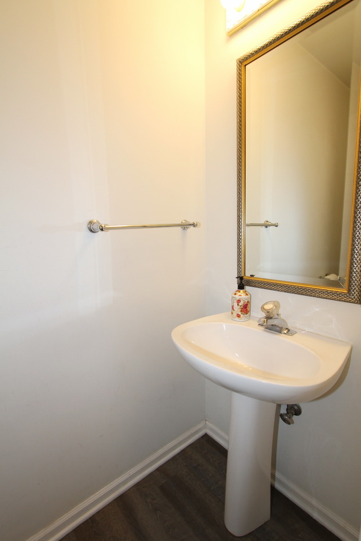 2165 Hidden Valley Drive Naperville, IL 60565 - Photo 11 of 29 a bathroom with a sink and mirror