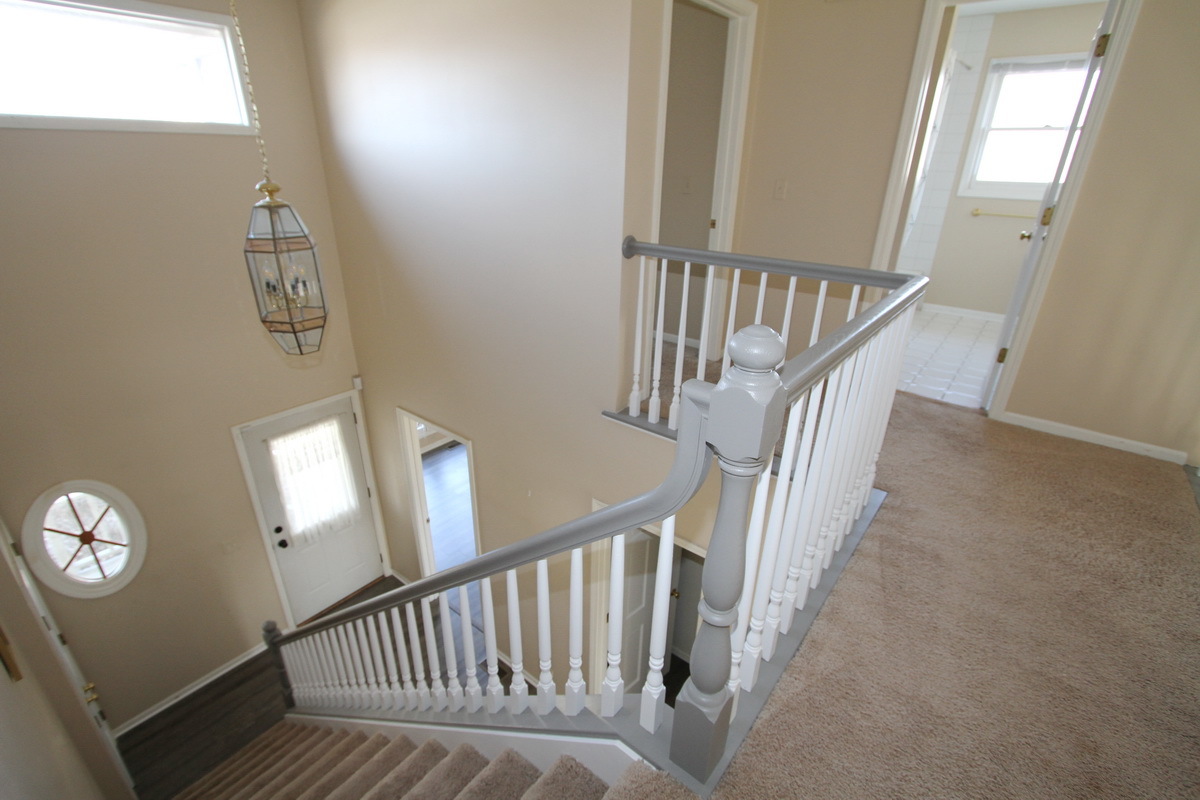2165 Hidden Valley Drive Naperville, IL 60565 - Photo 13 of 29 a view of staircase with railing and white walls