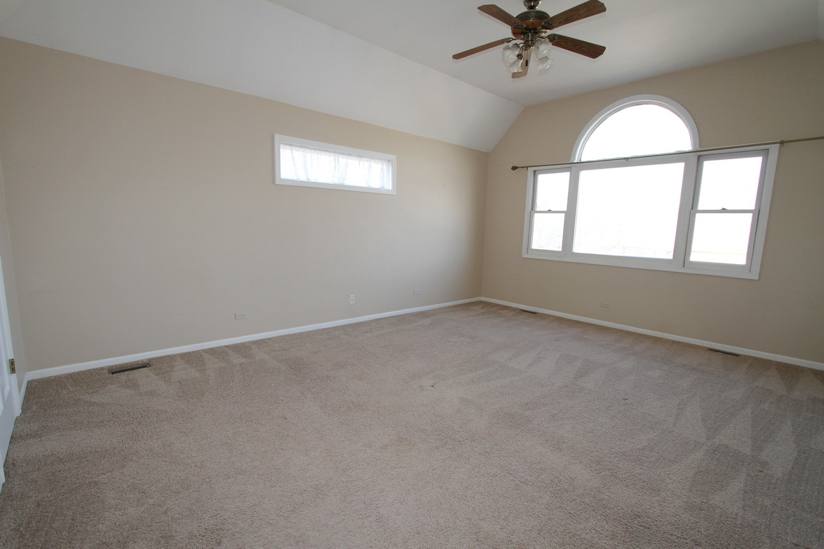 2165 Hidden Valley Drive Naperville, IL 60565 - Photo 14 of 29 an empty room with a window