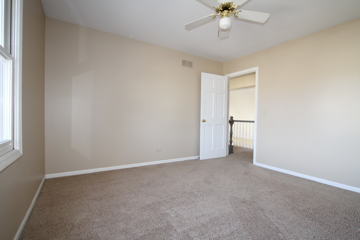 2165 Hidden Valley Drive Naperville, IL 60565 - Photo 18 of 29 a view of an empty room with a window