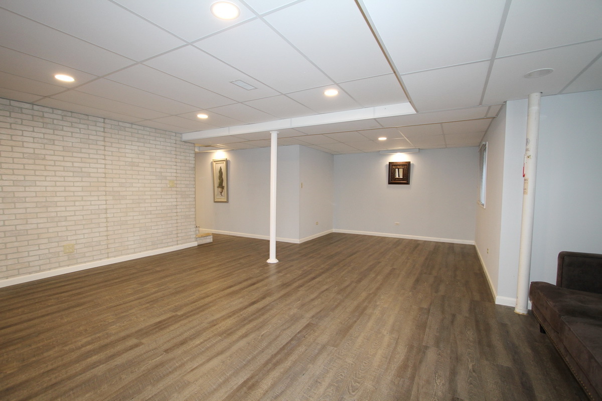 2165 Hidden Valley Drive Naperville, IL 60565 - Photo 22 of 29 a view of empty room with wooden floor