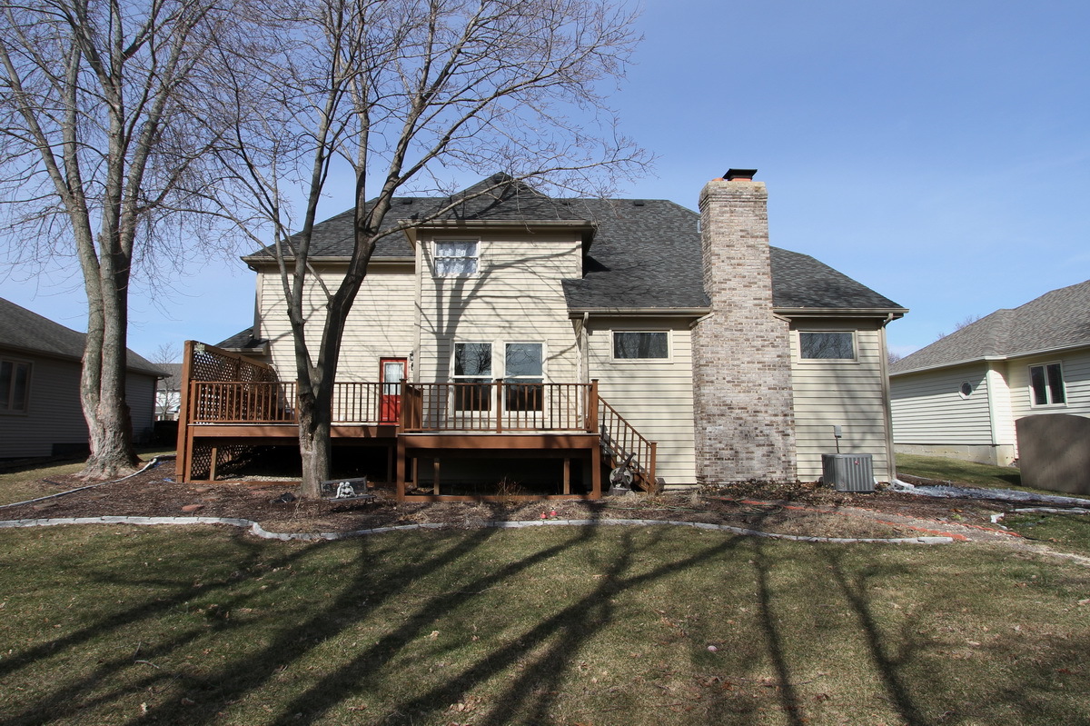 2165 Hidden Valley Drive Naperville, IL 60565 - Photo 27 of 29 a front view of a house with a yard