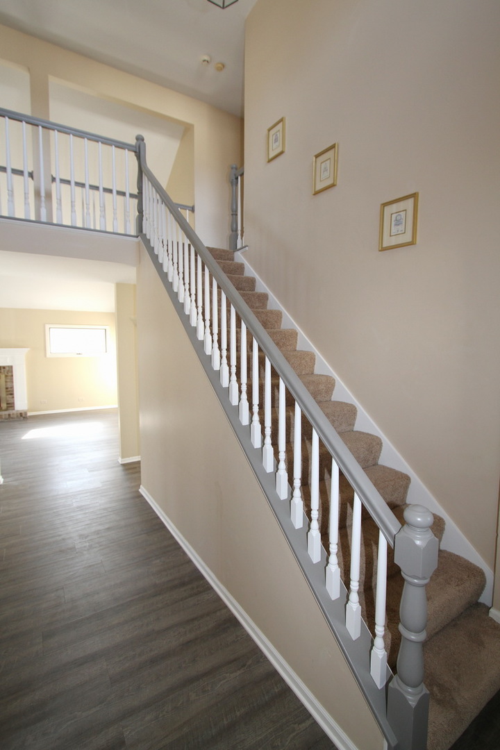 2165 Hidden Valley Drive Naperville, IL 60565 - Photo 3 of 29 a view of an entryway with wooden floor